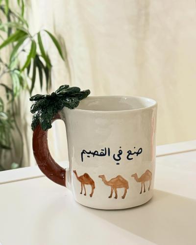 كوب القصيم مع تغيير مكان الكلام واختلاف بالرسمه