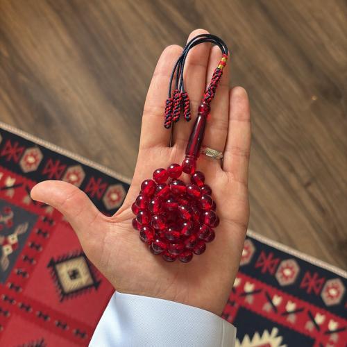 مسباح بكلايت بلون احمر شفاف