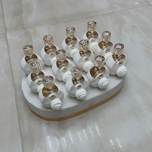 توزيعات عطور فرزاتشي مع التزين والصينيه الدرزن 12ح...