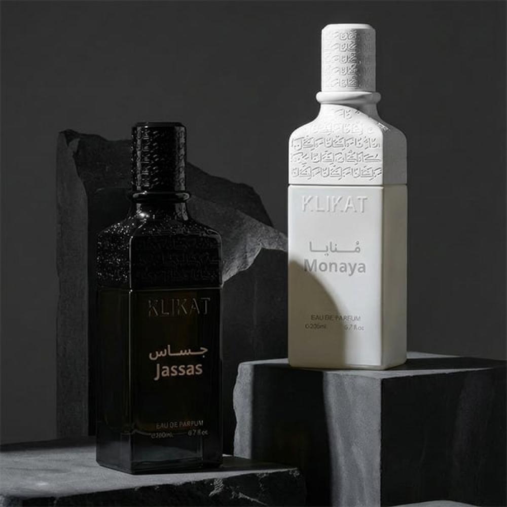 زجاجتان عطر فاخرتان منفصلتان سوداء وبيضاء مع نقوش