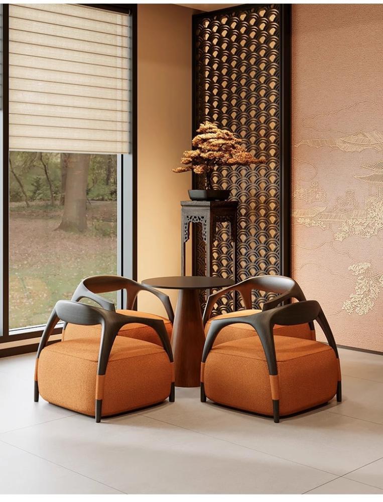 كرسي أريكة باللون البرتقالي بتصميم إبداعي