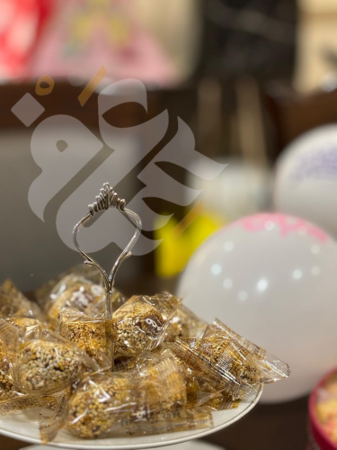 كرات التمر بالسمسم بحشوة الطحينة البلدي