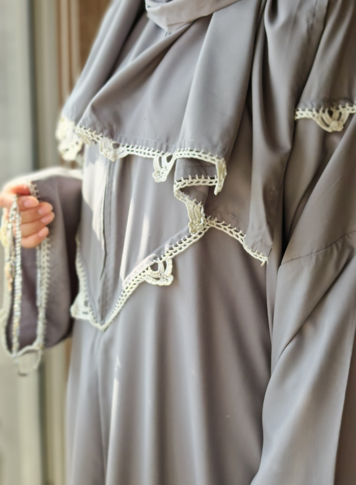 Gray prayer sheet with white and gray crochet decoration from