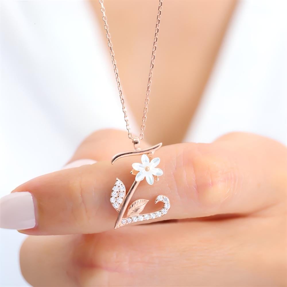 A sophisticated silver chain plated with gold, bearing the letter