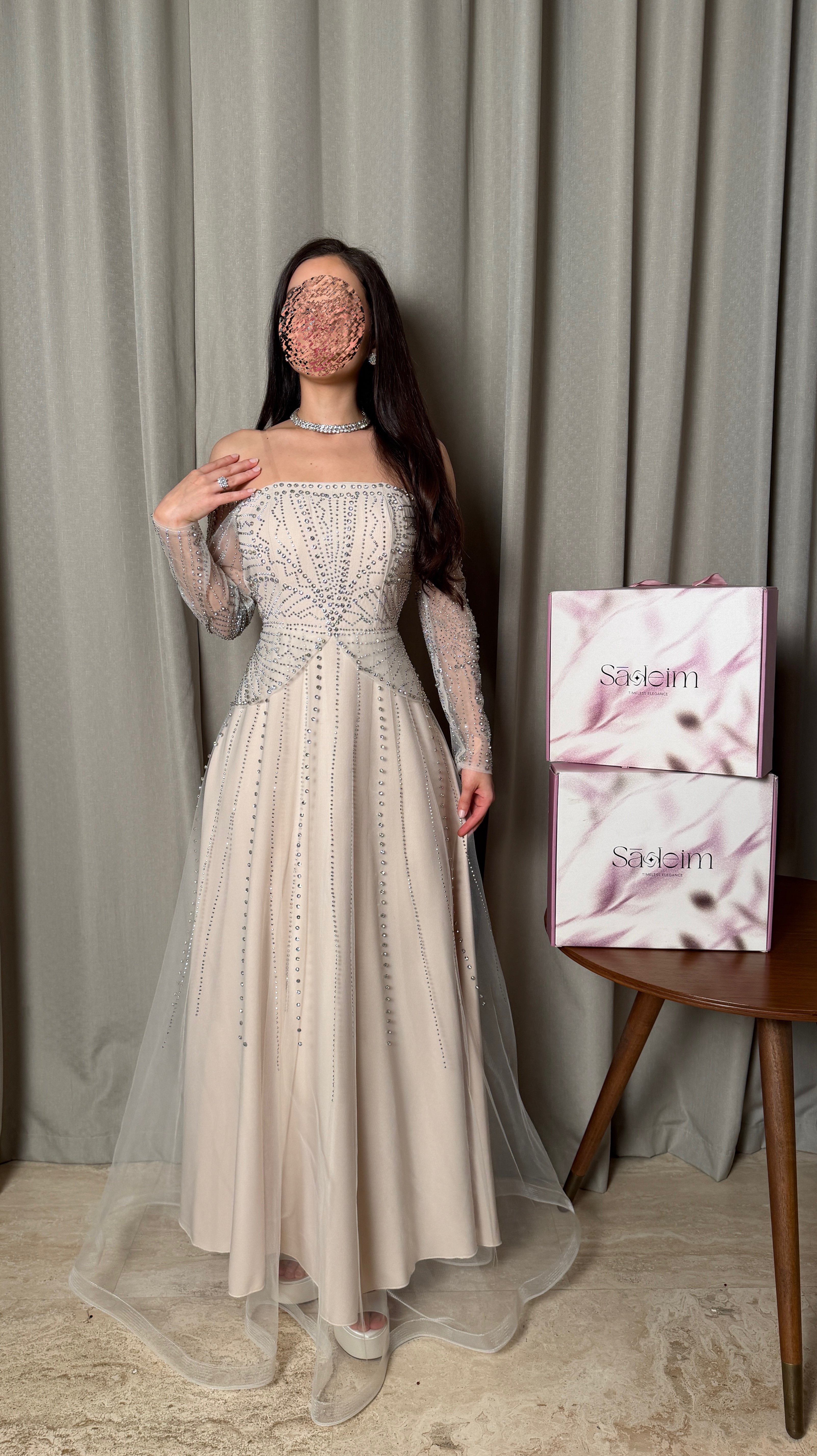Light beige evening dress with long sleeves