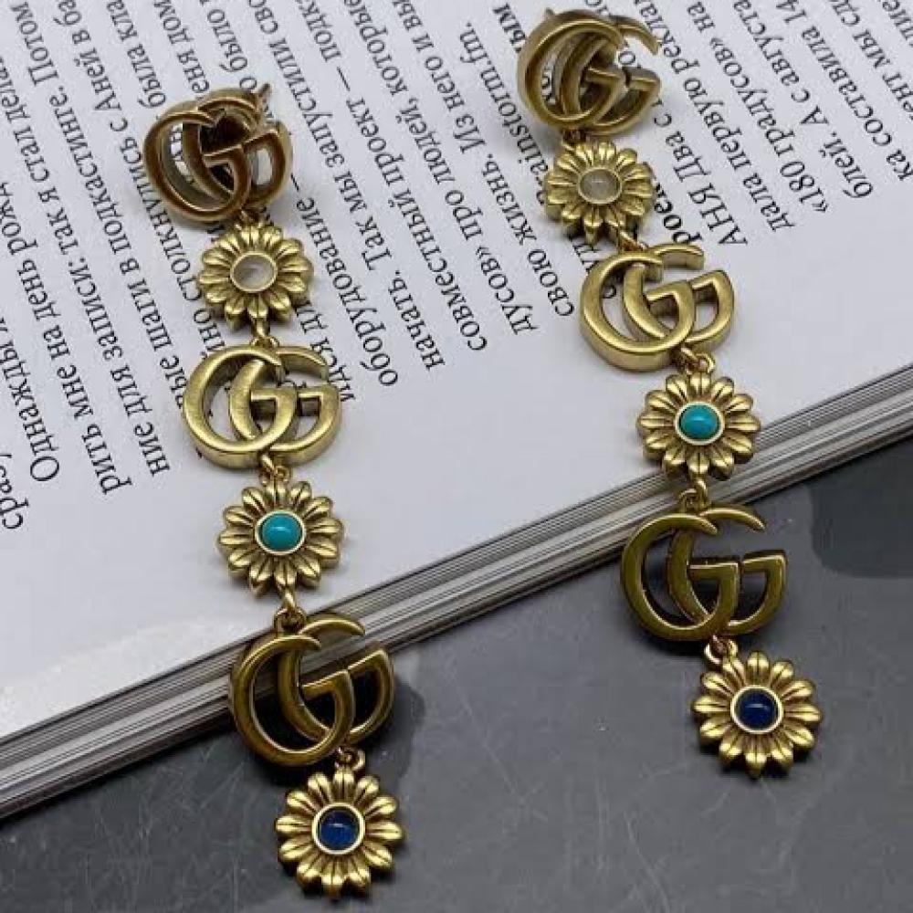 اقراط Gucci طويلة بتصميم زهور