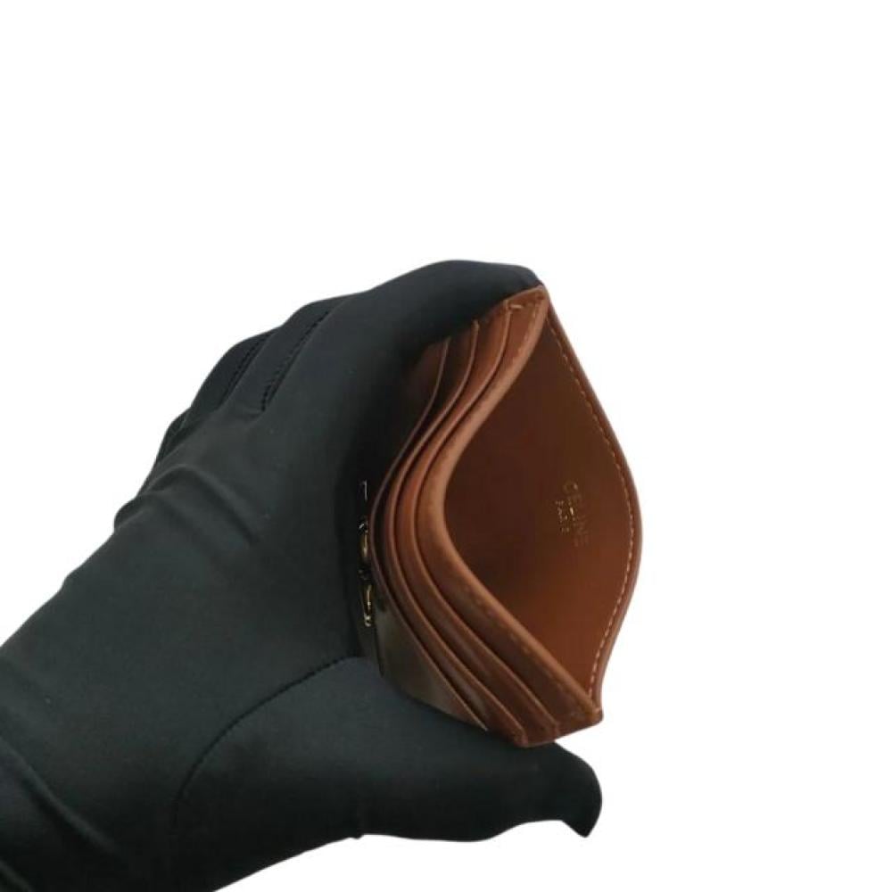 محفظة بطاقات تريومف من الجلد اللامع بشعار سيلين الذهبي