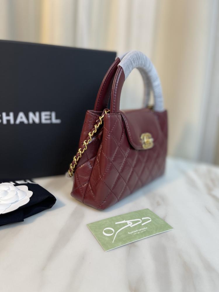 حقيبة يد وكتف من شانيل بقفل دوار CC - برغندي