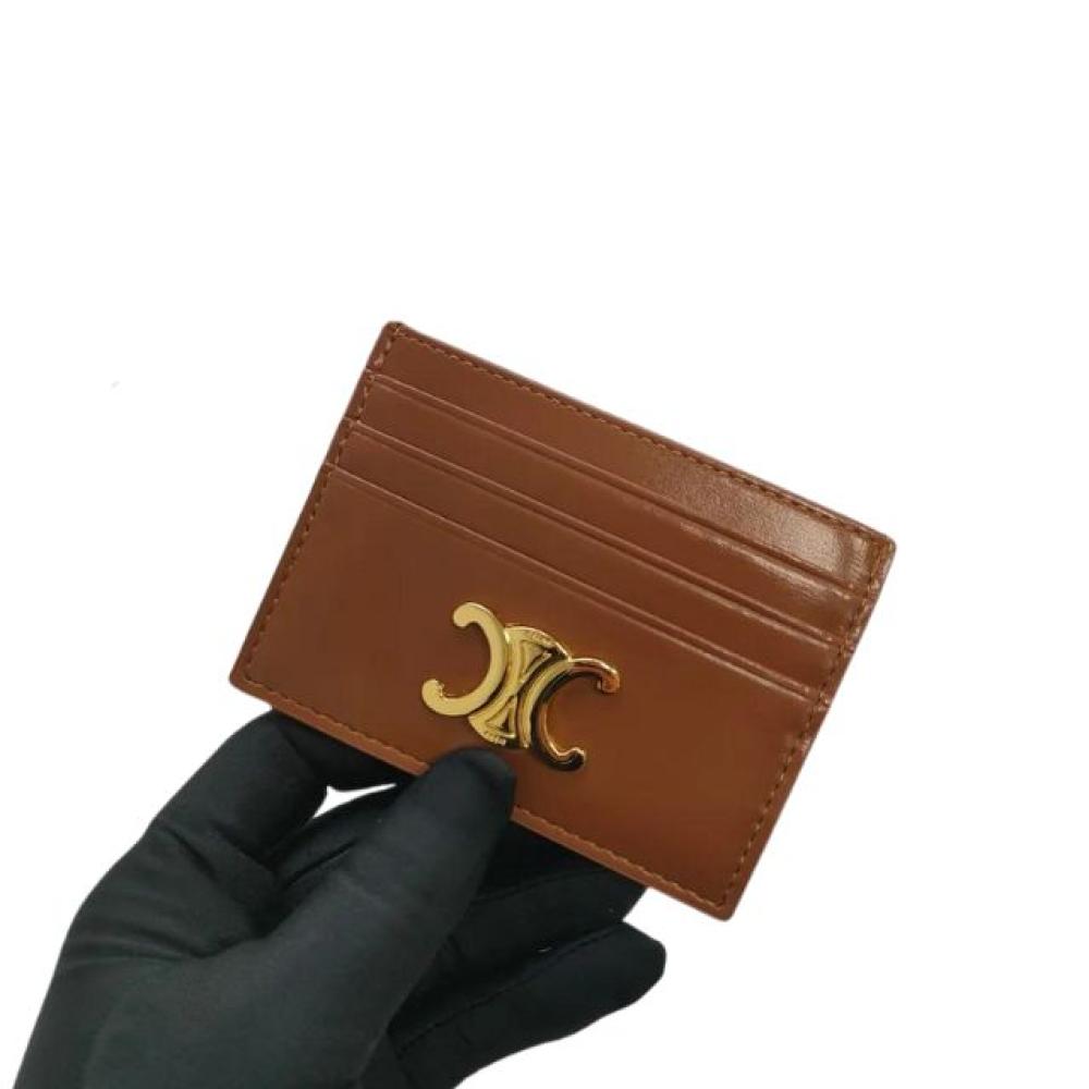 محفظة بطاقات تريومف من الجلد اللامع بشعار سيلين الذهبي