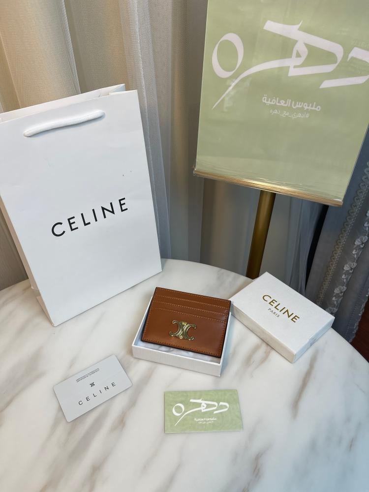 محفظة بطاقات تريومف من الجلد اللامع بشعار سيلين الذهبي