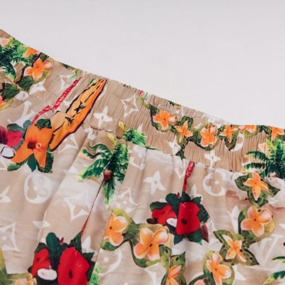 شورت سباحة مونوغرام مطبوعة بالأنماط الاستوائية من لويس فيتون