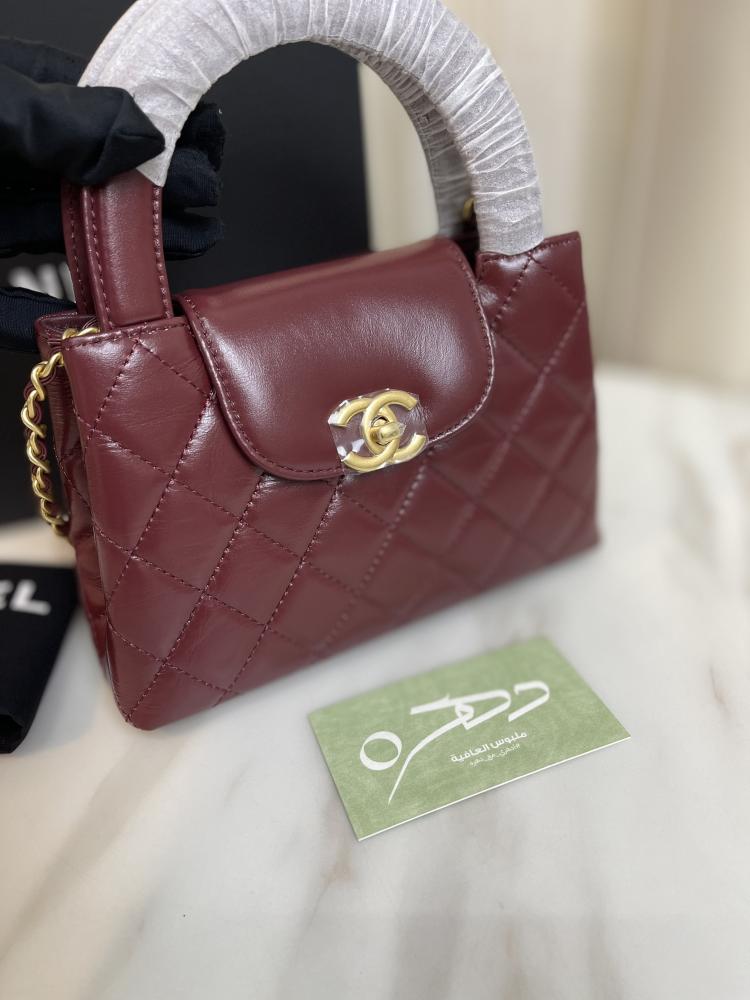 حقيبة يد وكتف من شانيل بقفل دوار CC - برغندي