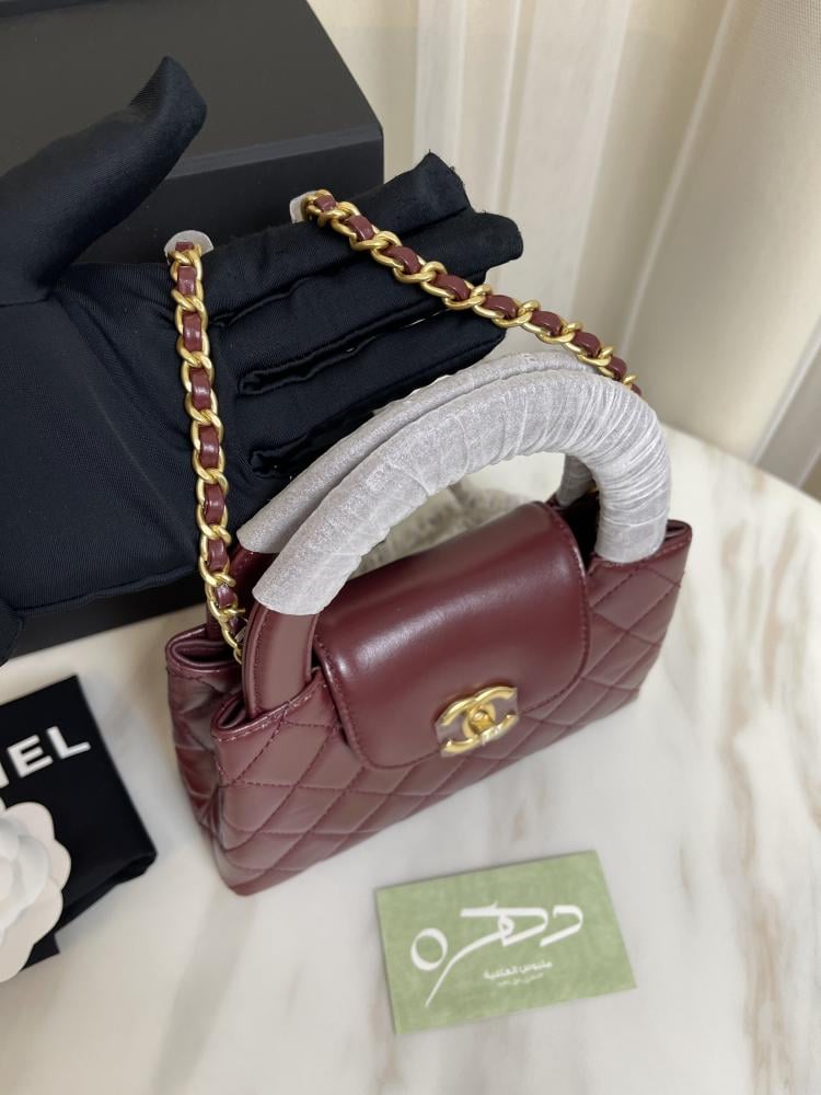 حقيبة يد وكتف من شانيل بقفل دوار CC - برغندي