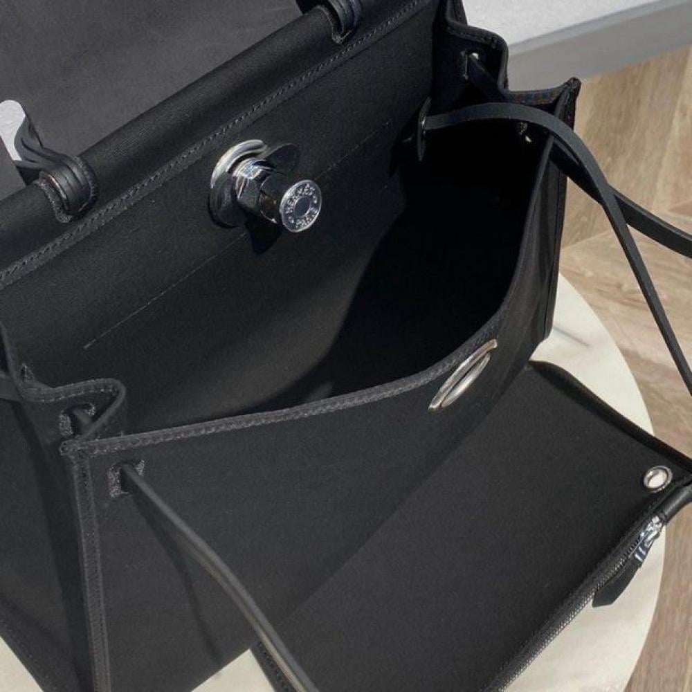 حقيبة هيرباج توال 31 بقماش وجلد أسود من ايرميز