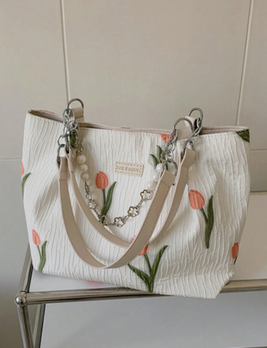 حقيبة يد نسائية بطبعات زهور