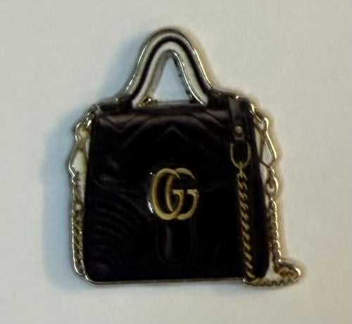 ستيكر معدني شنطة قوتشي