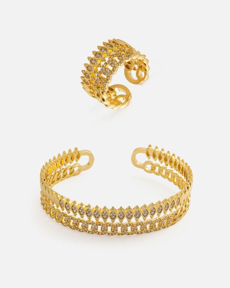 A distinctive women's set: a bracelet and ring in gold color.
