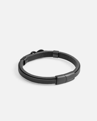 Two black leather bracelets joined together