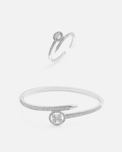 Women's bracelet and ring set with an interlocking design in silver.