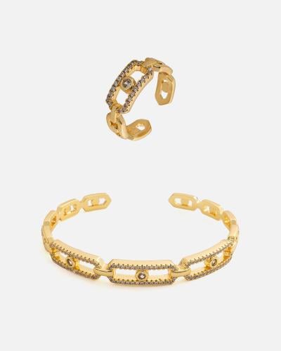 A distinctive women's set: a bracelet and ring in gold color.