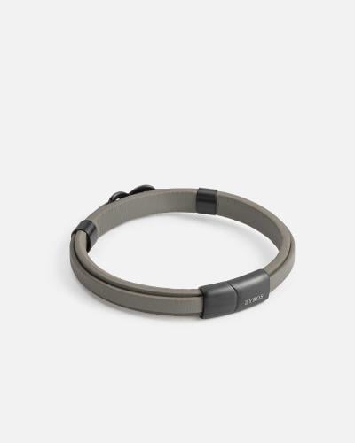Two gray leather bracelets joined together