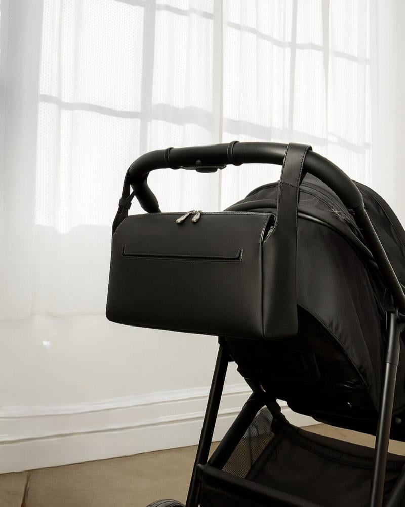 شنطة عملية وأنيقة مناسبة لعربات الأطفال بلون أسود