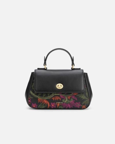 A women's black leather bag adorned with colorful embroidery.