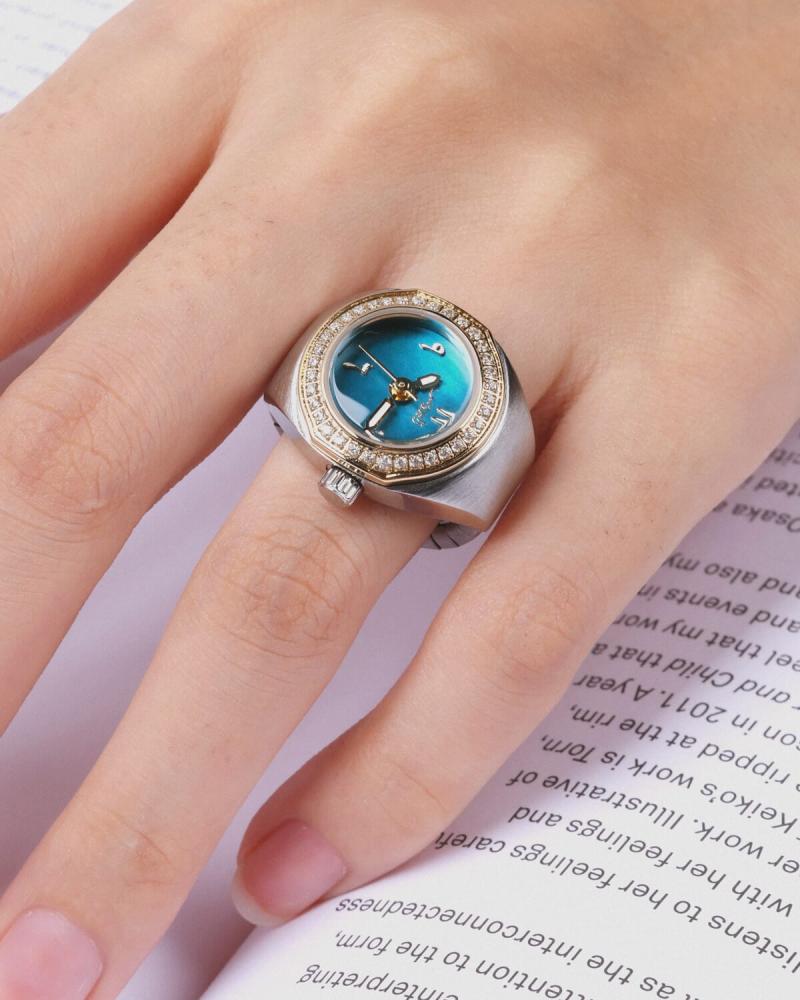 Women's ring watch with an eye-catching design in gold and silver