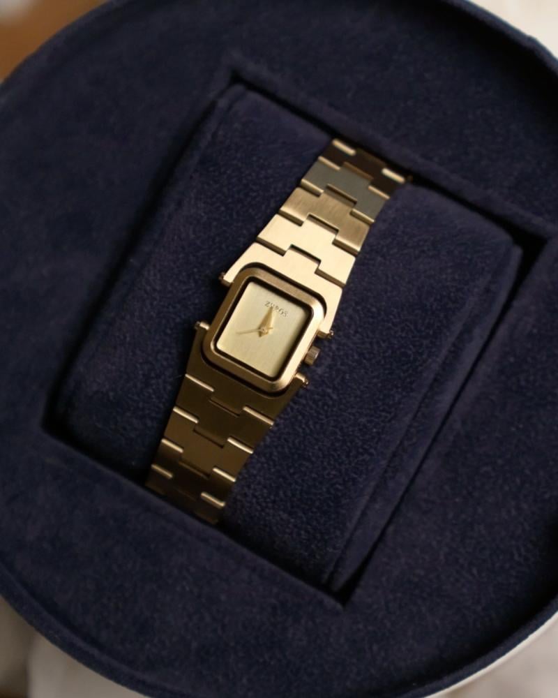 ساعة مدى النسائية بسير من الستيل بلون ذهبي