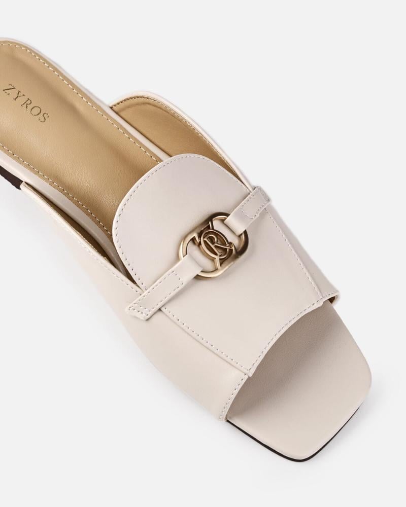 Women's flat shoes with a stylish design in beige