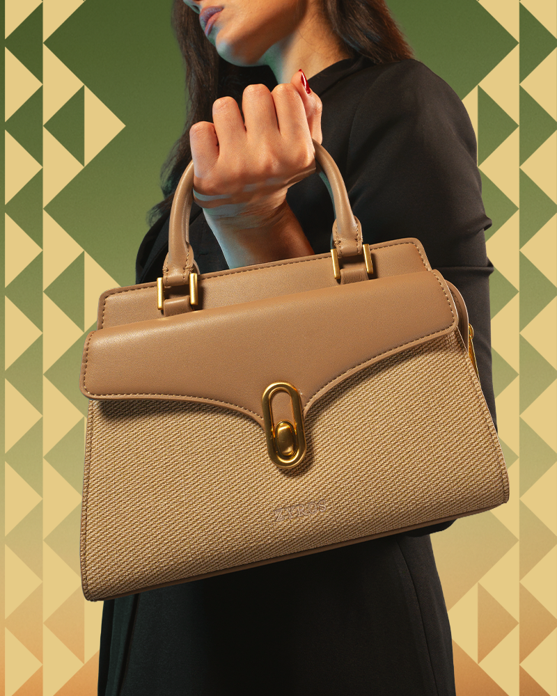 Women's beige leather handbag with a classic design