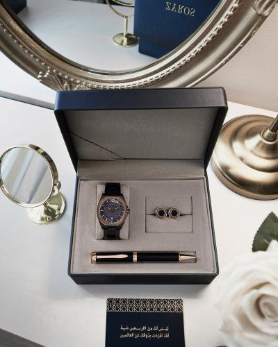 A men's gift set including a watch, pen, and cufflinks