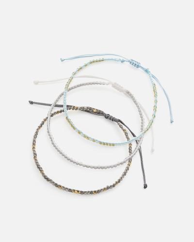 Bracelets made of threads and beads in shades of gray and blue