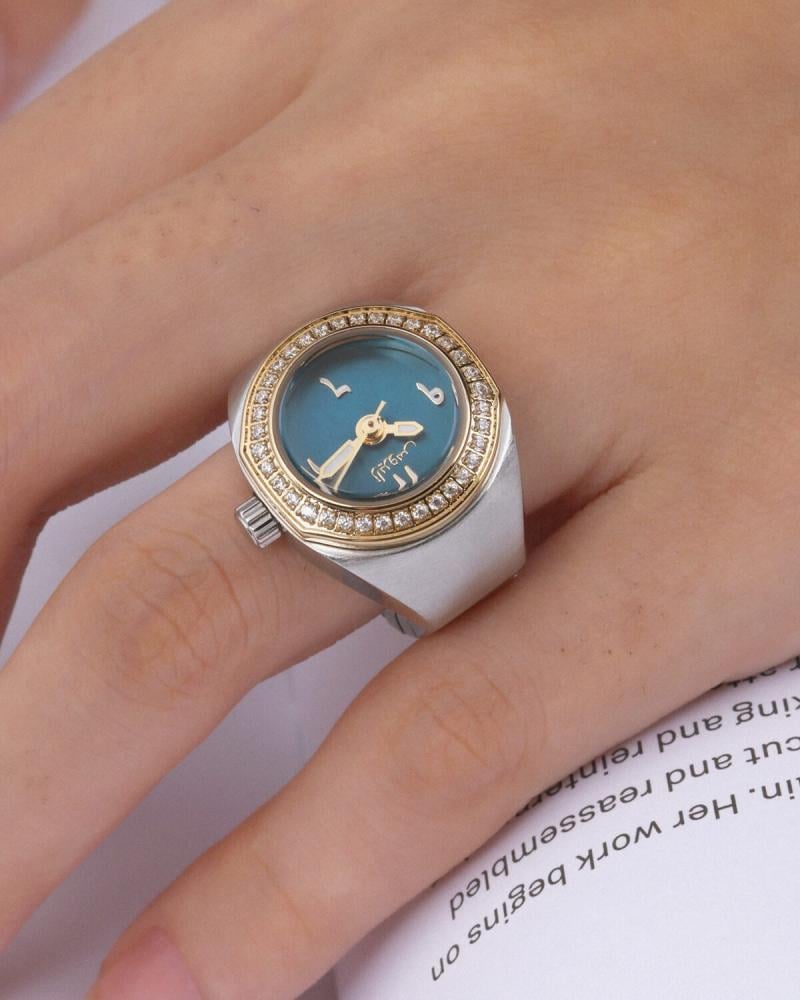 Women's ring watch with an eye-catching design in gold and silver