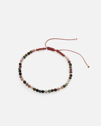 Women's bracelet with colorful beads and woven threads