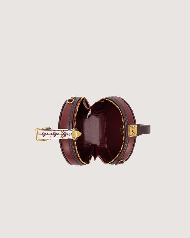 Women's mini round bag in burgundy color