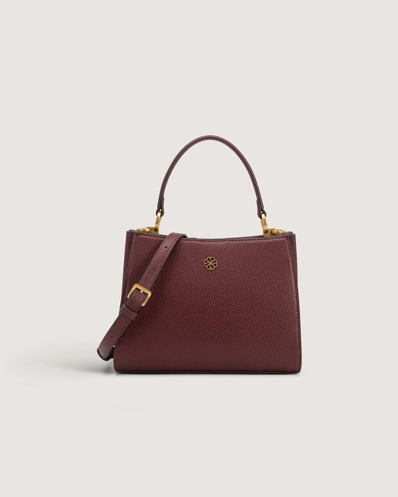 A versatile leather bag in a burgundy color