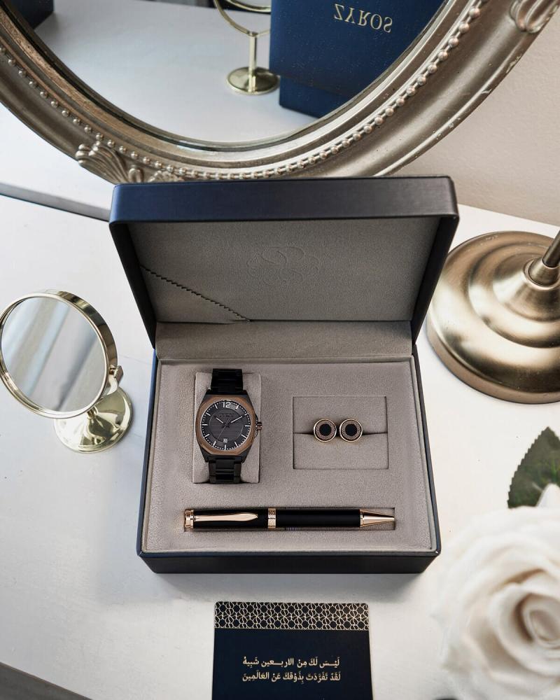 A men's gift set including a watch, pen, and cufflinks