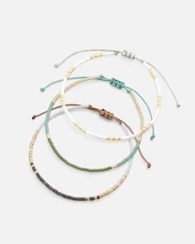Bracelets made of threads and beads in gold, turquoise and gray