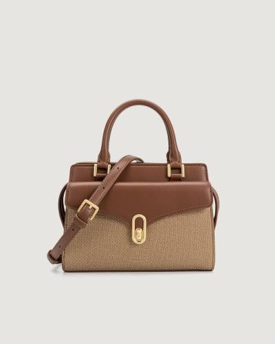 Women's brown leather handbag with a classic design