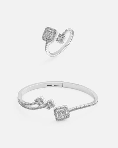 Women's bracelet and ring set with an interlocking design in silver.