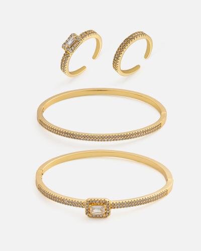 Women's set: two bracelets and two rings in gold color
