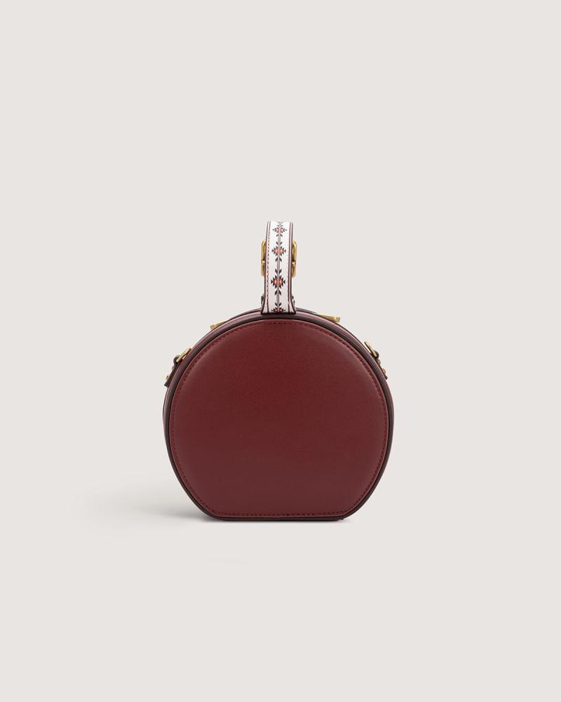 Women's mini round bag in burgundy color