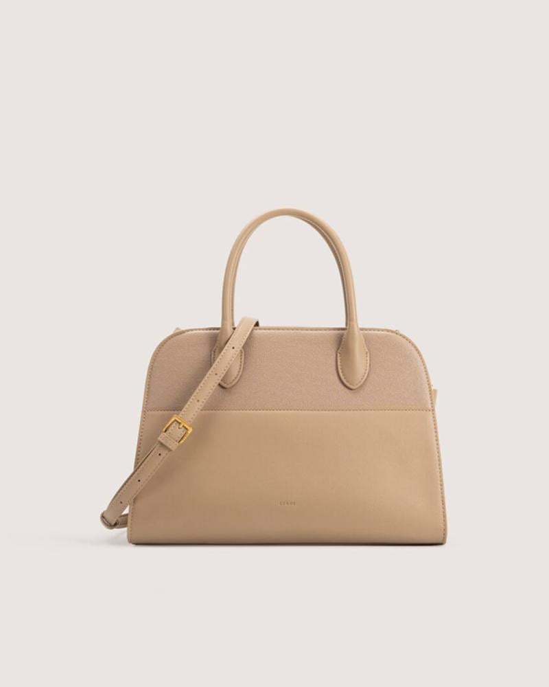 شنطة نسائية بحجم واسع بلون وردي