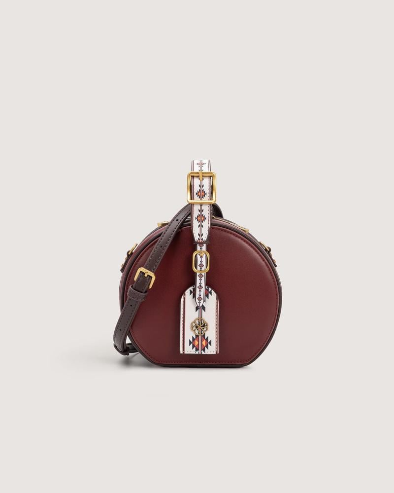 Women's mini round bag in burgundy color