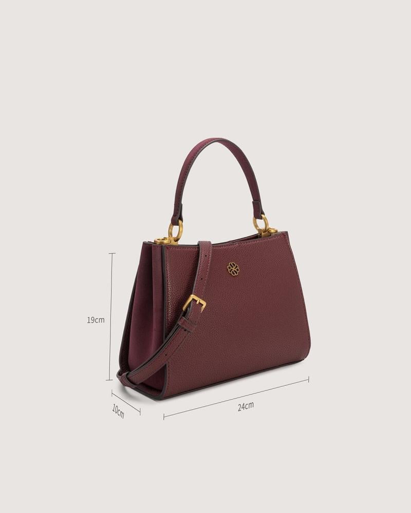 A versatile leather bag in a burgundy color