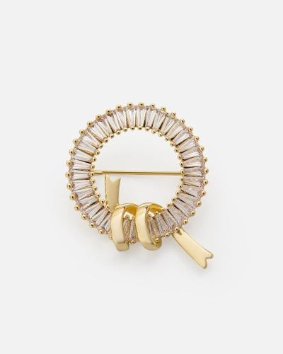 Elegant women's brooch in gold
