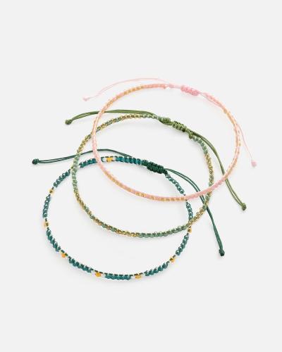 Bracelets made of threads and beads in a harmonious range of colors