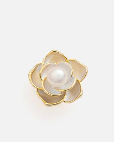 Women's brooch with a unique design in gold color
