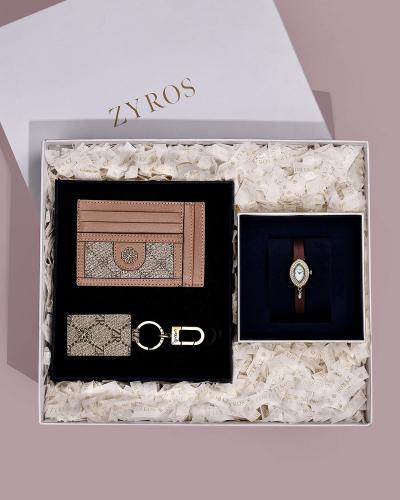 A women's gift set including a watch, wallet, and keychain